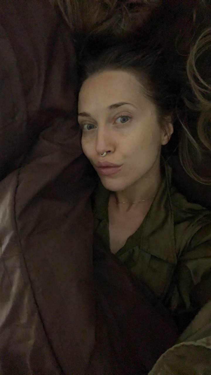 Natali Raievska photo sent via Telegram — olive top, bedtime selfie