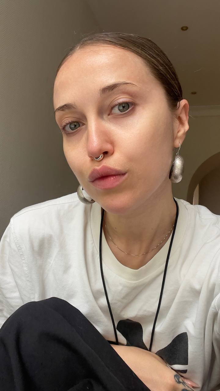 Natali Raievska in white t-shirt with silver earrings