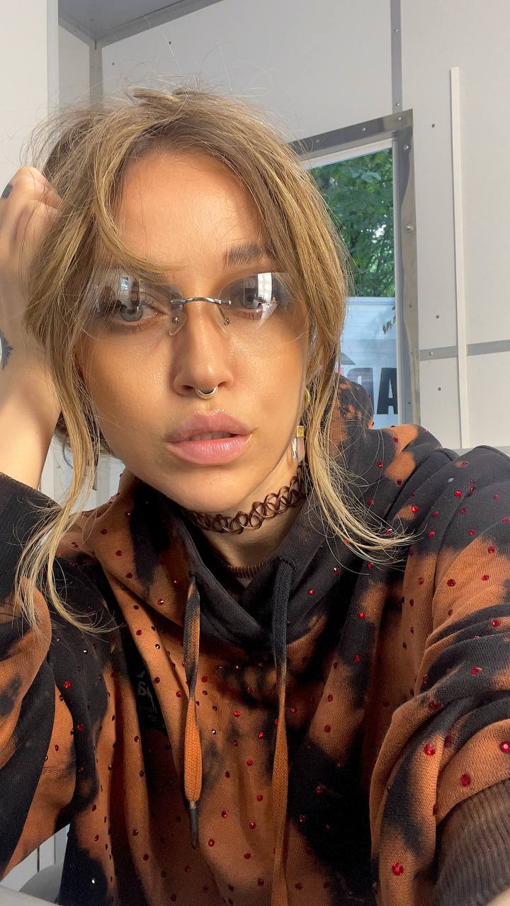 Natali Raievska in red-gem hoodie with glasses