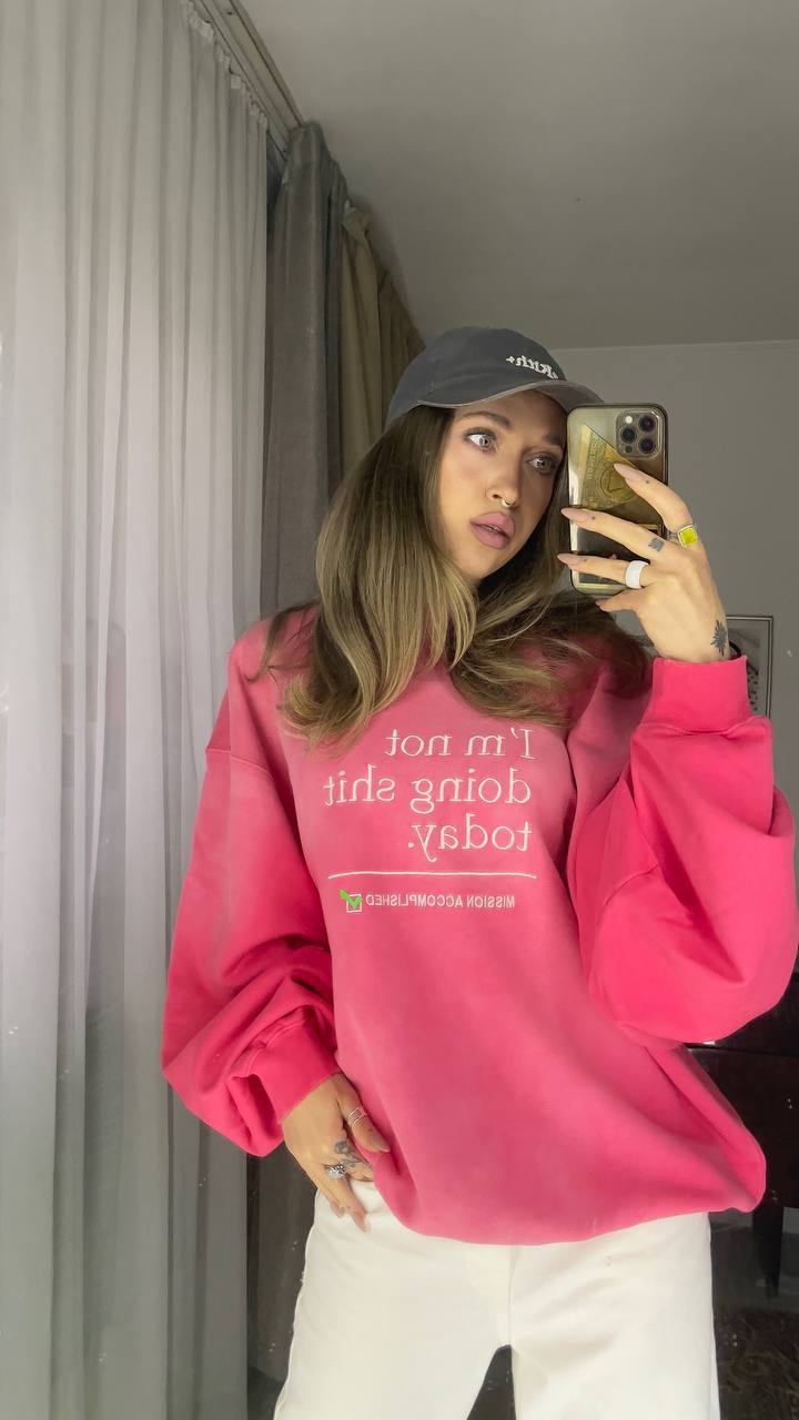 Natali Raievska in pink hoodie — home mirror selfie