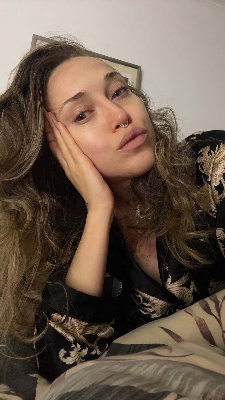 Natali Raievska in dragon robe — curly hair, bed selfie