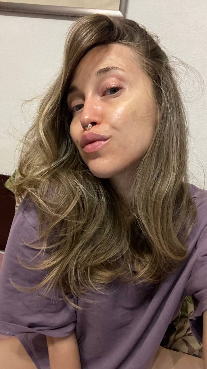Natali Raievska in lavender t-shirt — direct gaze selfie