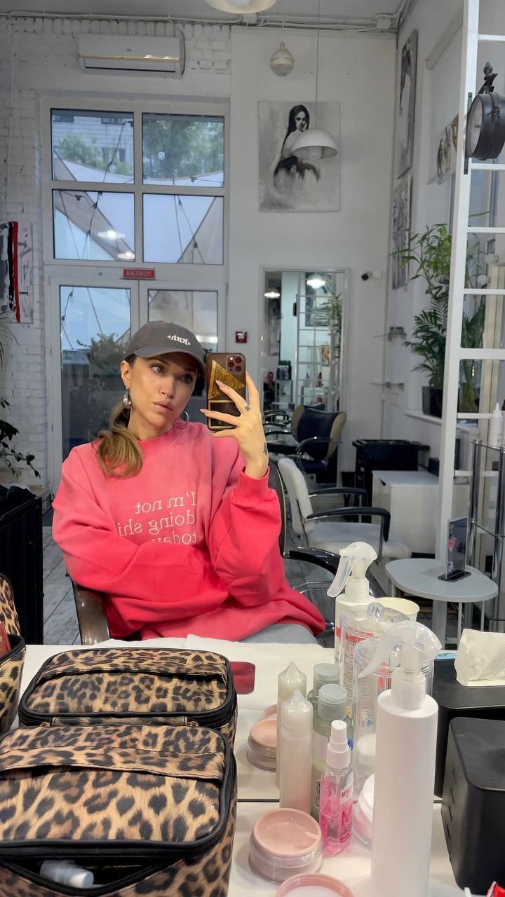 Natali Raievska at salon — pink hoodie, sent via Telegram