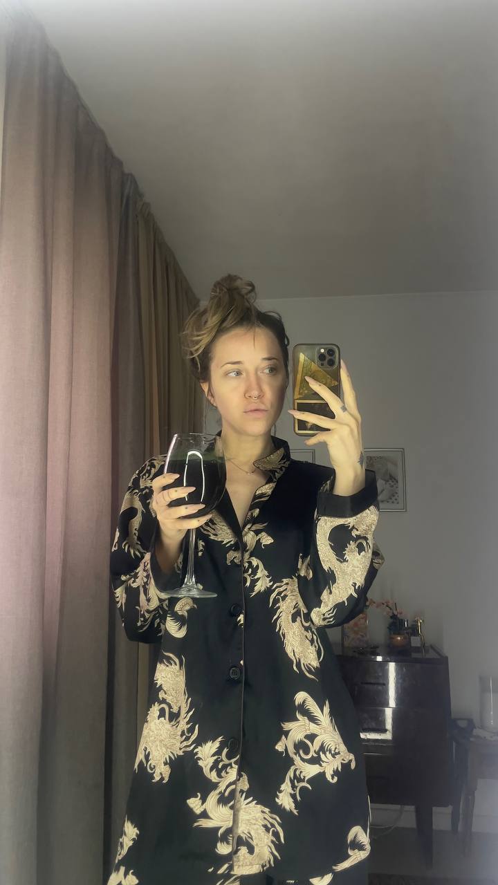 Natali Raievska mirror selfie sent via Telegram — dragon robe, wine glass